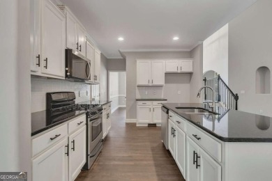 Spacious home nestled in the sought-after Bridgemill community on Bridgemill Golf Club in Georgia - for sale on GolfHomes.com, golf home, golf lot