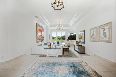 Exceptional Loxahatchee Club lake and golf course views can be on The Loxahatchee Club in Florida - for sale on GolfHomes.com, golf home, golf lot