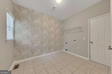 Spacious home nestled in the sought-after Bridgemill community on Bridgemill Golf Club in Georgia - for sale on GolfHomes.com, golf home, golf lot