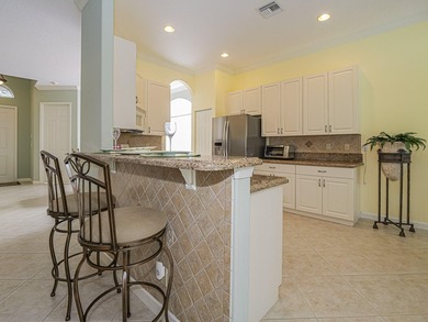 This exceptional 3-bedroom, 2-bathroom screened Pool home with on Champions Club at Summerfield in Florida - for sale on GolfHomes.com, golf home, golf lot