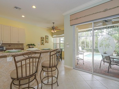 This exceptional 3-bedroom, 2-bathroom screened Pool home with on Champions Club at Summerfield in Florida - for sale on GolfHomes.com, golf home, golf lot