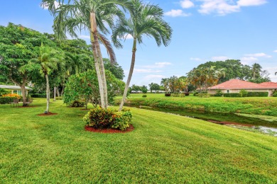 Lovely waterfront villa with private backyard space in the City on Atlantis Golf Club in Florida - for sale on GolfHomes.com, golf home, golf lot