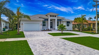 Welcome to paradise! This luxury, brand new home is being built on Island Country Club in Florida - for sale on GolfHomes.com, golf home, golf lot