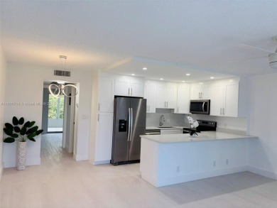 Contemporary designpletely renovated turnkey beautiful 1 bed 1.5 on Hillsboro Pines Golf in Florida - for sale on GolfHomes.com, golf home, golf lot