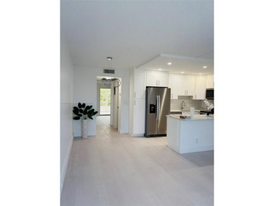 Contemporary designpletely renovated turnkey beautiful 1 bed 1.5 on Hillsboro Pines Golf in Florida - for sale on GolfHomes.com, golf home, golf lot