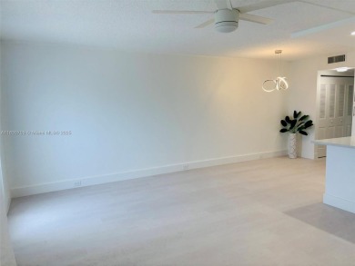 Contemporary designpletely renovated turnkey beautiful 1 bed 1.5 on Hillsboro Pines Golf in Florida - for sale on GolfHomes.com, golf home, golf lot