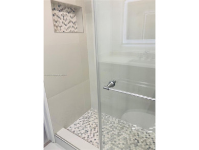 Contemporary designpletely renovated turnkey beautiful 1 bed 1.5 on Hillsboro Pines Golf in Florida - for sale on GolfHomes.com, golf home, golf lot