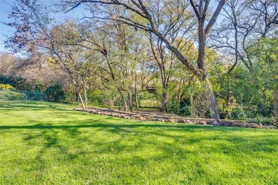 Situated on a gorgeous half acre creek lot this one-story, 4 on Sherrill Park Golf Course in Texas - for sale on GolfHomes.com, golf home, golf lot