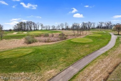 Custom built ranch with finished basement & a covered 288 sf on The Orchards Golf Club in Michigan - for sale on GolfHomes.com, golf home, golf lot