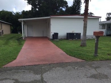 This home recently underwent a total rehab.  New vinyl plank on Spanish Lakes I in Florida - for sale on GolfHomes.com, golf home, golf lot