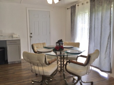 This home recently underwent a total rehab.  New vinyl plank on Spanish Lakes I in Florida - for sale on GolfHomes.com, golf home, golf lot