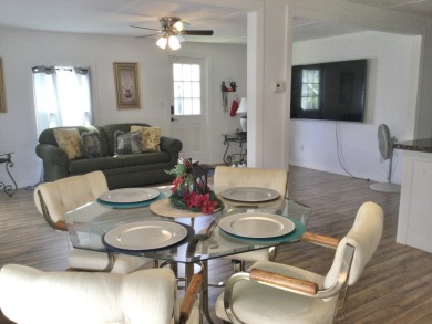 This home recently underwent a total rehab.  New vinyl plank on Spanish Lakes I in Florida - for sale on GolfHomes.com, golf home, golf lot