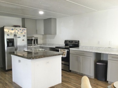 This home recently underwent a total rehab.  New vinyl plank on Spanish Lakes I in Florida - for sale on GolfHomes.com, golf home, golf lot
