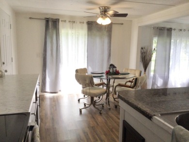 This home recently underwent a total rehab.  New vinyl plank on Spanish Lakes I in Florida - for sale on GolfHomes.com, golf home, golf lot