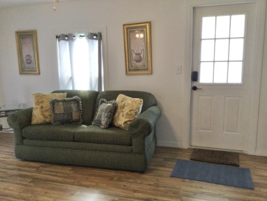 This home recently underwent a total rehab.  New vinyl plank on Spanish Lakes I in Florida - for sale on GolfHomes.com, golf home, golf lot