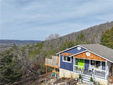 BREATHTAKING VIEWS of the lake and mountains year round!  This on Holiday Island Executive Golf Course in Arkansas - for sale on GolfHomes.com, golf home, golf lot