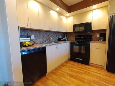 TURN KEY 900 SQ FT 1 BEDROOM IN PRESTIGIOUS ARUBA. EVERYTHING on Wynmoor Golf Course in Florida - for sale on GolfHomes.com, golf home, golf lot