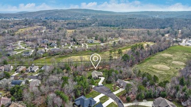 Nestled on a beautifully landscaped .77-acre golf front lot with on Heatherhurst Golf Course in Tennessee - for sale on GolfHomes.com, golf home, golf lot