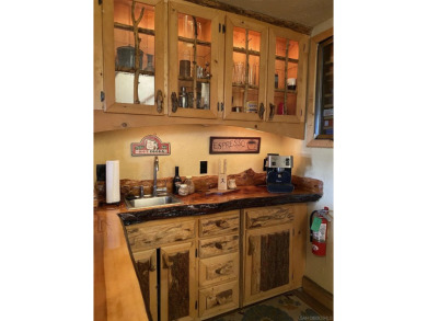Beautiful log home with an amazing view to the west, located on on Big Bear Mountain Ski and Golf Resort in California - for sale on GolfHomes.com, golf home, golf lot