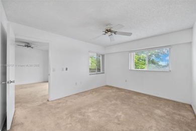 Resort-Style Living in Century Village! Enjoy stunning lake on Flamingo Lakes Country Club in Florida - for sale on GolfHomes.com, golf home, golf lot
