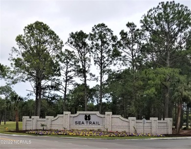 Large, wooded lot on Oyster Bay #11 Hole in Sea Trail Plantation on Sea Trail Golf Resort in North Carolina - for sale on GolfHomes.com, golf home, golf lot