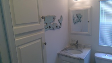 This adorable park model is conveniently located at the front of on Lily Lake Golf and RV Resort in Florida - for sale on GolfHomes.com, golf home, golf lot