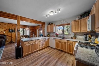 Escape to this adorable, remodeled 3 bedroom 2 bath cabin on Pinetop Lakes Country Club in Arizona - for sale on GolfHomes.com, golf home, golf lot