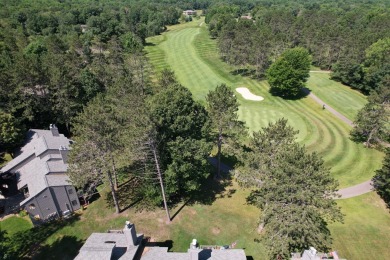 Discover the epitome of convenience and comfort in this on Michaywe Pines Course in Michigan - for sale on GolfHomes.com, golf home, golf lot