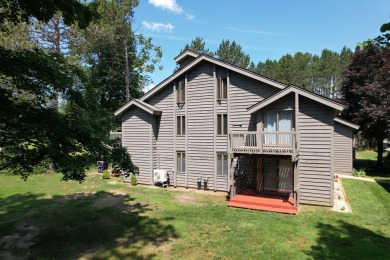 Discover the epitome of convenience and comfort in this on Michaywe Pines Course in Michigan - for sale on GolfHomes.com, golf home, golf lot