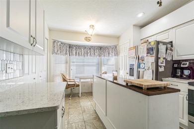 Beautifully updated 1,421 square foot home that features an on Tampa Bay Golf and Country Club in Florida - for sale on GolfHomes.com, golf home, golf lot