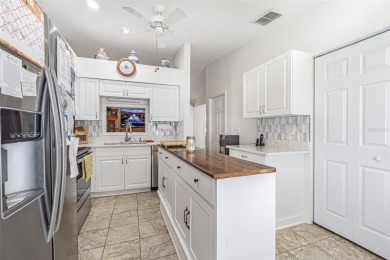 Beautifully updated 1,421 square foot home that features an on Tampa Bay Golf and Country Club in Florida - for sale on GolfHomes.com, golf home, golf lot