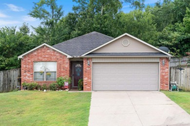 This charming, well-maintained 3 bedroom, 2 bath home is nestled on Silver Springs Country Club in Arkansas - for sale on GolfHomes.com, golf home, golf lot