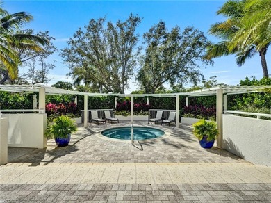 Imagine living amidst the colors of the sea in this on Club at Pelican Bay Golf Course in Florida - for sale on GolfHomes.com, golf home, golf lot