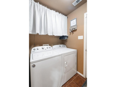 This charming, well-maintained 3 bedroom, 2 bath home is nestled on Silver Springs Country Club in Arkansas - for sale on GolfHomes.com, golf home, golf lot