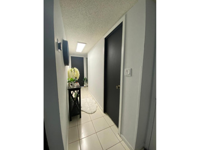 This spacious 2-bedroom, 2-bathroom unit features an open living on Inverrary Country Club in Florida - for sale on GolfHomes.com, golf home, golf lot