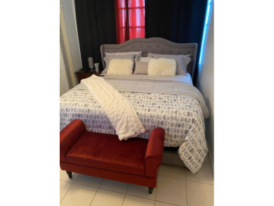 This spacious 2-bedroom, 2-bathroom unit features an open living on  in Florida - for sale on GolfHomes.com, golf home, golf lot