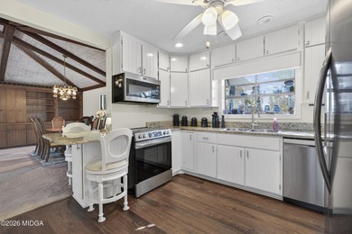 Beautiful all-brick home on the 2nd fairway! This 3-bedroom on Canongate At Healy Point Country Club in Georgia - for sale on GolfHomes.com, golf home, golf lot