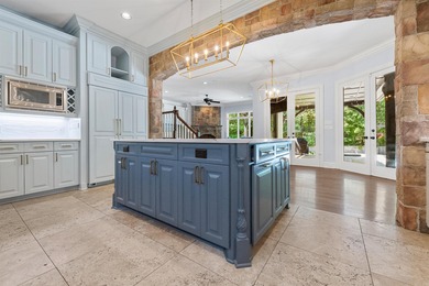 Designed for both elegant entertaining and everyday living, this on Chenal Country Club - Bear Den Mountain in Arkansas - for sale on GolfHomes.com, golf home, golf lot