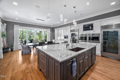 Welcome to an unparalleled sanctuary of luxury!  This on Hasentree Club in North Carolina - for sale on GolfHomes.com, golf home, golf lot