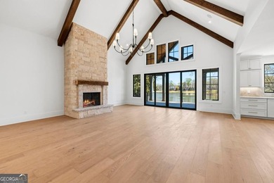 COMPLETELY RENOVATED. REIMAGINED. PRACTICALLY REBUILT FROM THE on Great Waters Course At Reynolds Plantation in Georgia - for sale on GolfHomes.com, golf home, golf lot