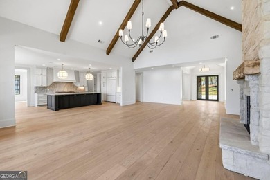 COMPLETELY RENOVATED. REIMAGINED. PRACTICALLY REBUILT FROM THE on Great Waters Course At Reynolds Plantation in Georgia - for sale on GolfHomes.com, golf home, golf lot