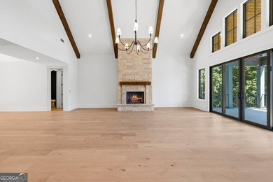 COMPLETELY RENOVATED. REIMAGINED. PRACTICALLY REBUILT FROM THE on Great Waters Course At Reynolds Plantation in Georgia - for sale on GolfHomes.com, golf home, golf lot