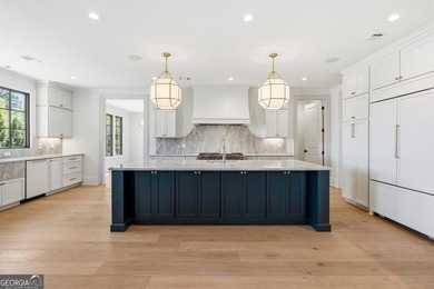 COMPLETELY RENOVATED. REIMAGINED. PRACTICALLY REBUILT FROM THE on Great Waters Course At Reynolds Plantation in Georgia - for sale on GolfHomes.com, golf home, golf lot