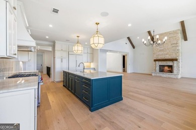 COMPLETELY RENOVATED. REIMAGINED. PRACTICALLY REBUILT FROM THE on Great Waters Course At Reynolds Plantation in Georgia - for sale on GolfHomes.com, golf home, golf lot