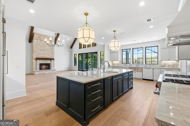 COMPLETELY RENOVATED. REIMAGINED. PRACTICALLY REBUILT FROM THE on Great Waters Course At Reynolds Plantation in Georgia - for sale on GolfHomes.com, golf home, golf lot