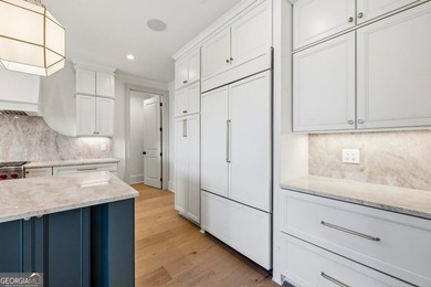 COMPLETELY RENOVATED. REIMAGINED. PRACTICALLY REBUILT FROM THE on Great Waters Course At Reynolds Plantation in Georgia - for sale on GolfHomes.com, golf home, golf lot