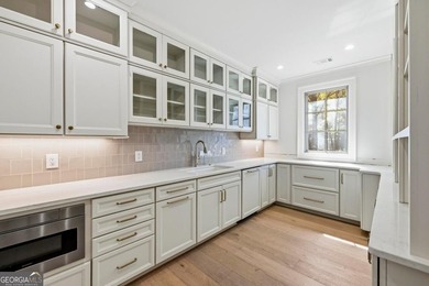 COMPLETELY RENOVATED. REIMAGINED. PRACTICALLY REBUILT FROM THE on Great Waters Course At Reynolds Plantation in Georgia - for sale on GolfHomes.com, golf home, golf lot