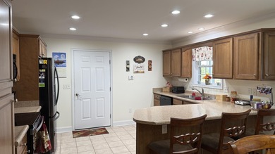 Welcome to an exceptional residence in Battlefield Estates on Battlefield Golf and Country Club in Kentucky - for sale on GolfHomes.com, golf home, golf lot