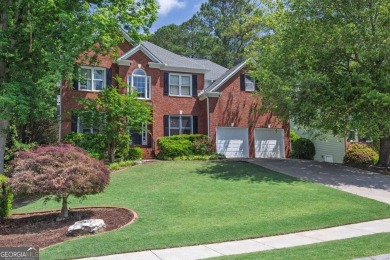 Perfectly positioned on the fairway of the par-5 2nd hole in the on Towne Lake Hills Golf Club in Georgia - for sale on GolfHomes.com, golf home, golf lot