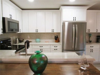 Come see this absolutely stunning and meticulously maintained 2 on East Bay Golf Club in Florida - for sale on GolfHomes.com, golf home, golf lot